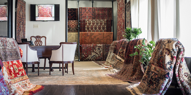 Aladdin Rug Gallery with numerous rugs displayed. Aladdin Rug Gallery with numerous rugs displayed.