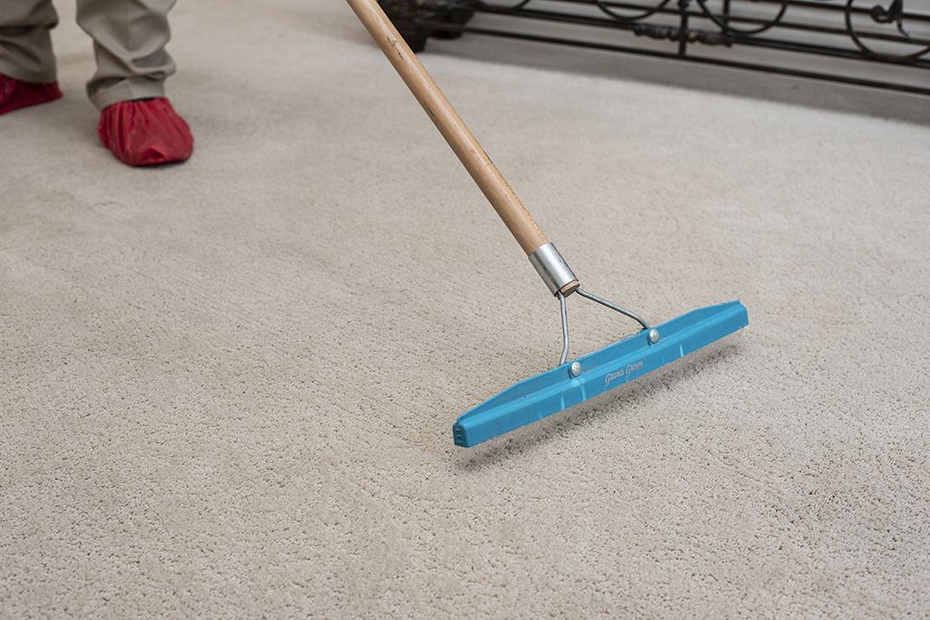An Aladdin technican resets pile on professionally cleaned carpt to restore the soft, fluffy appearance of carpet