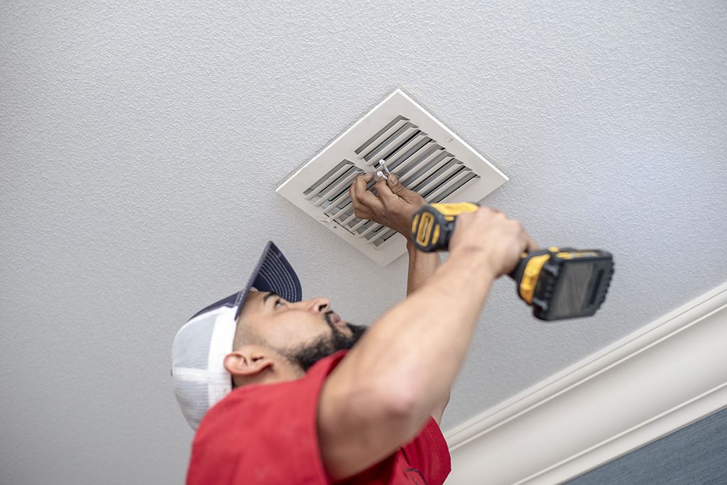 Aladdin cleaning specialist reinstalls vents and sanitizes air conditioning system