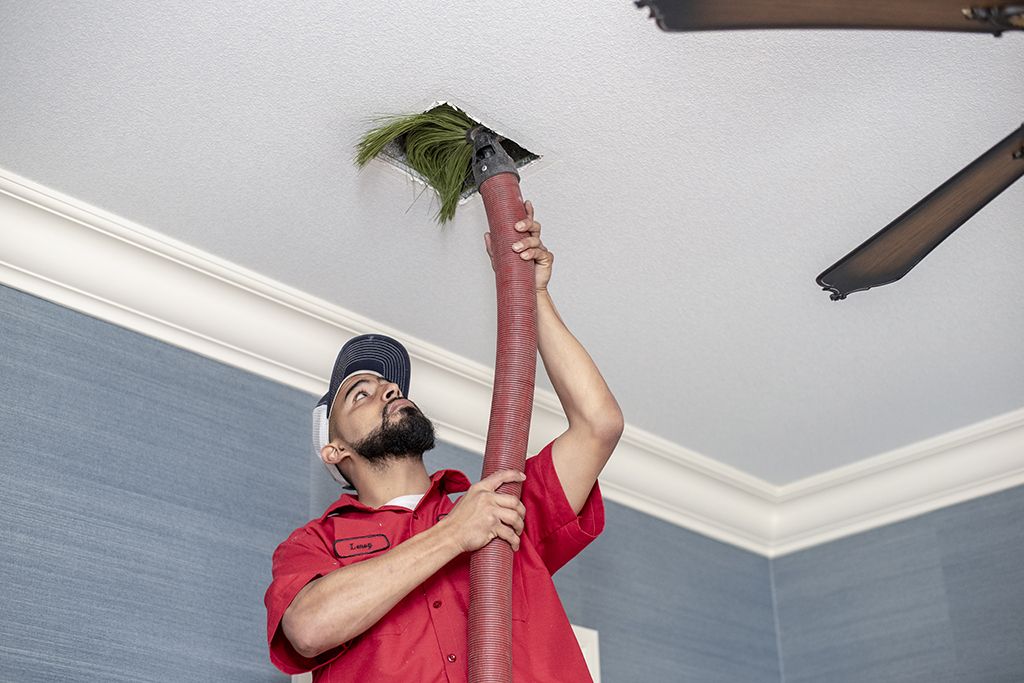Aladdin cleaning specialist professionally cleans air ducts with Rotobrush® system