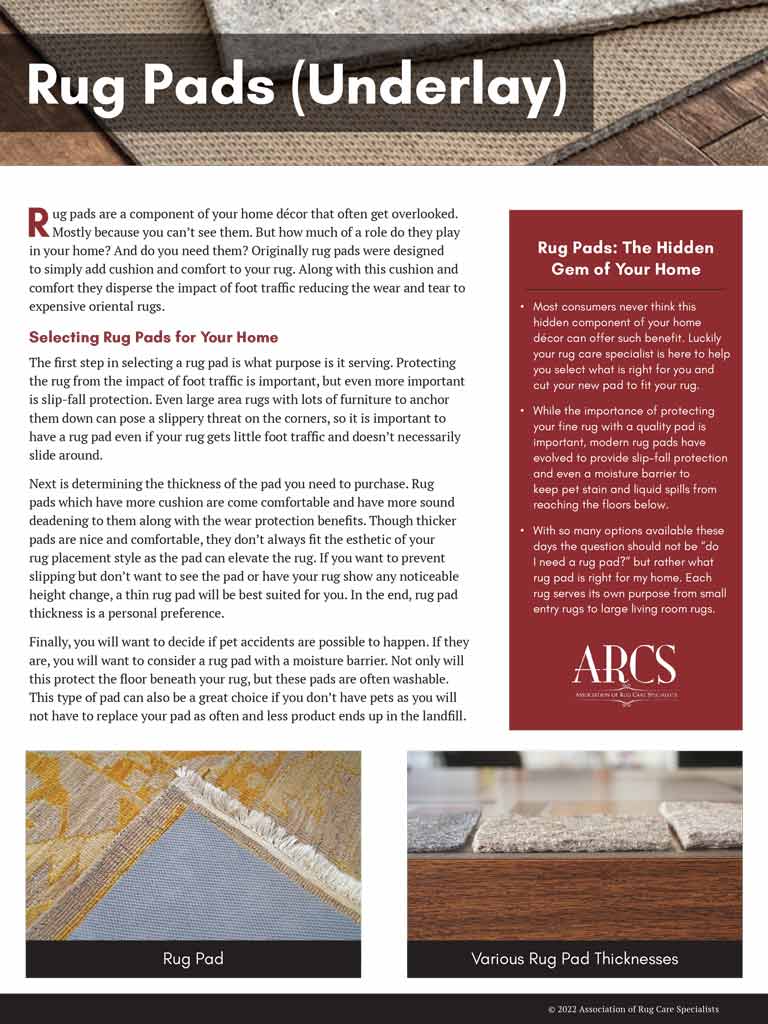 An Aladdin employee cleaning upholstered chair with tool.